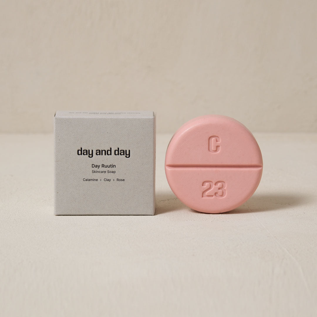 the paper box of the soap is on the left, the pink color soap is on the right.