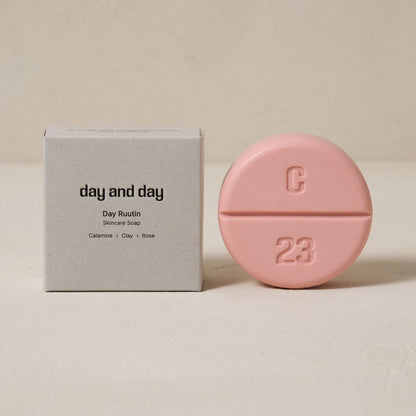 the paper box of the soap is on the left, the pink color soap is on the right.